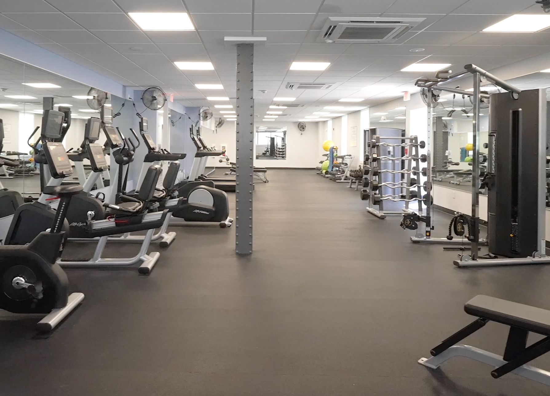 The fitness center with weights, treadmills, exercise bikes, and more